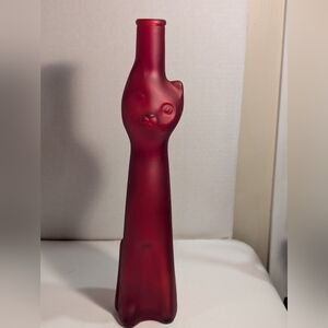 An empty Moselland "Happy Cat" or "Red Cat" figural Riesling wine bottle.
